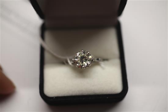 A modern platinum and solitaire diamond ring, size Q.